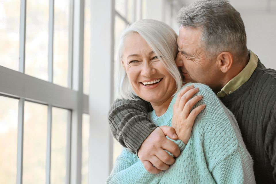 Family members sharing a warm hug at home